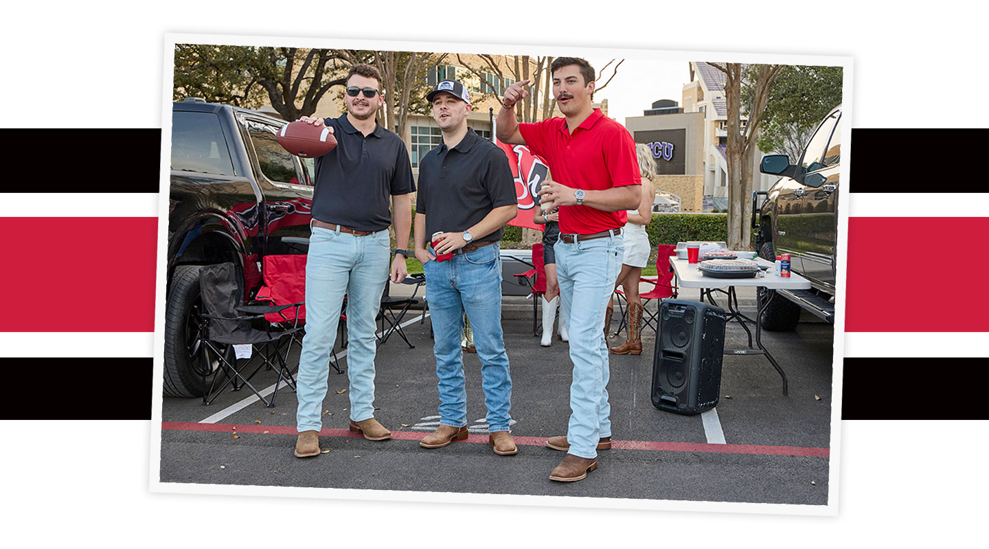 A group of men wearing Justin western boots are tailgaiting at a game.